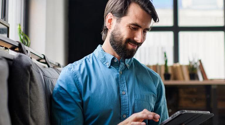 Man investing on tablet